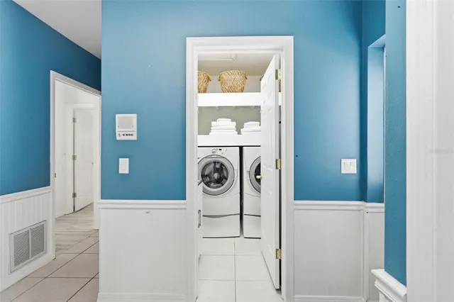 a living room with patio furniture and garden