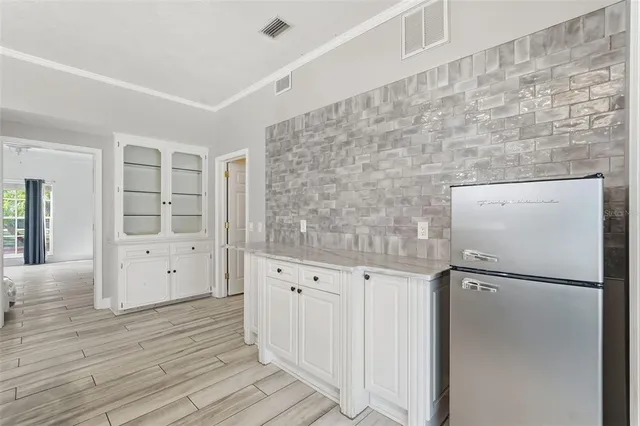 a large kitchen with cabinets