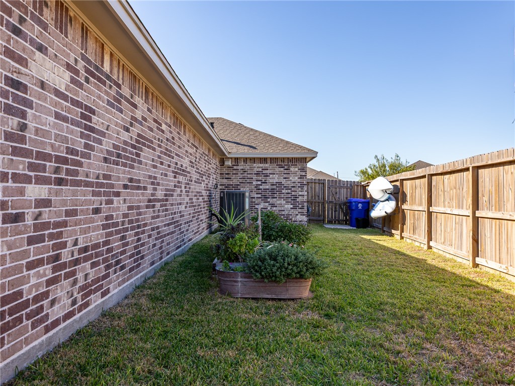 7938 Rancho Vista Boulevard East Corpus Christi, TX 78414 - Photo 34 of 37 Side yard with herb garden