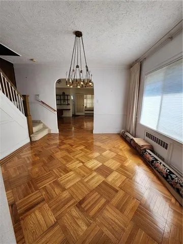 a view of hallway with wooden floor