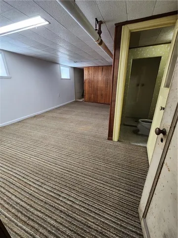 a bathroom with a granite countertop sink and vanity