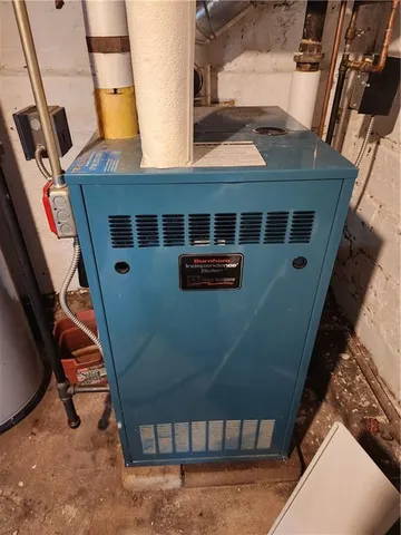 a view of gym equipment and refrigerator