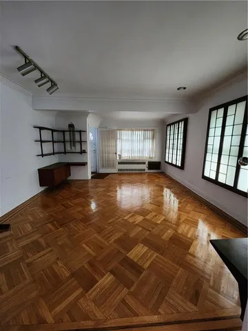 a view of an empty room with windows