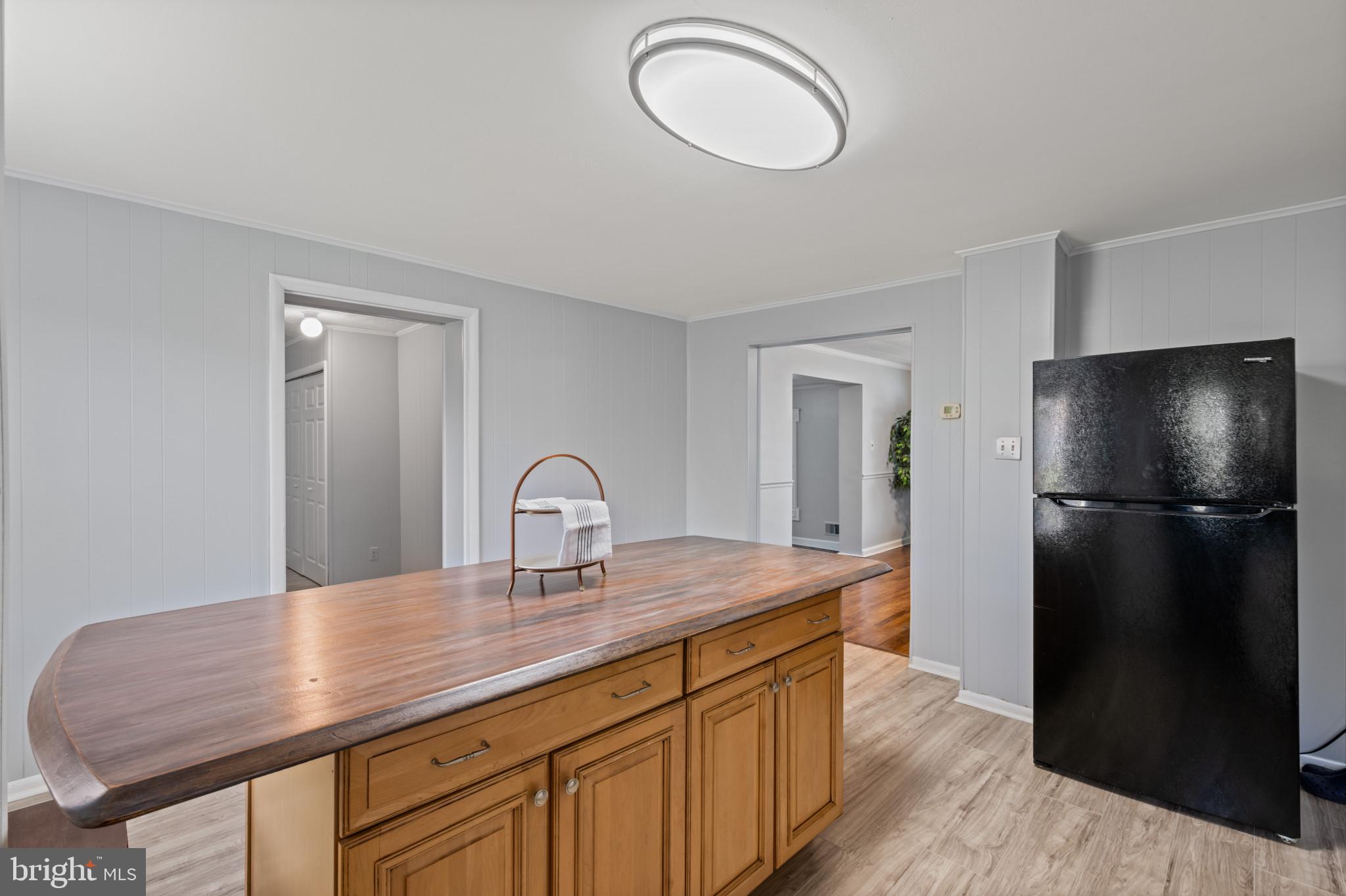 301 3rd Street Baltimore, MD 21206 - Photo 14 of 25 a kitchen with a refrigerator and a sink