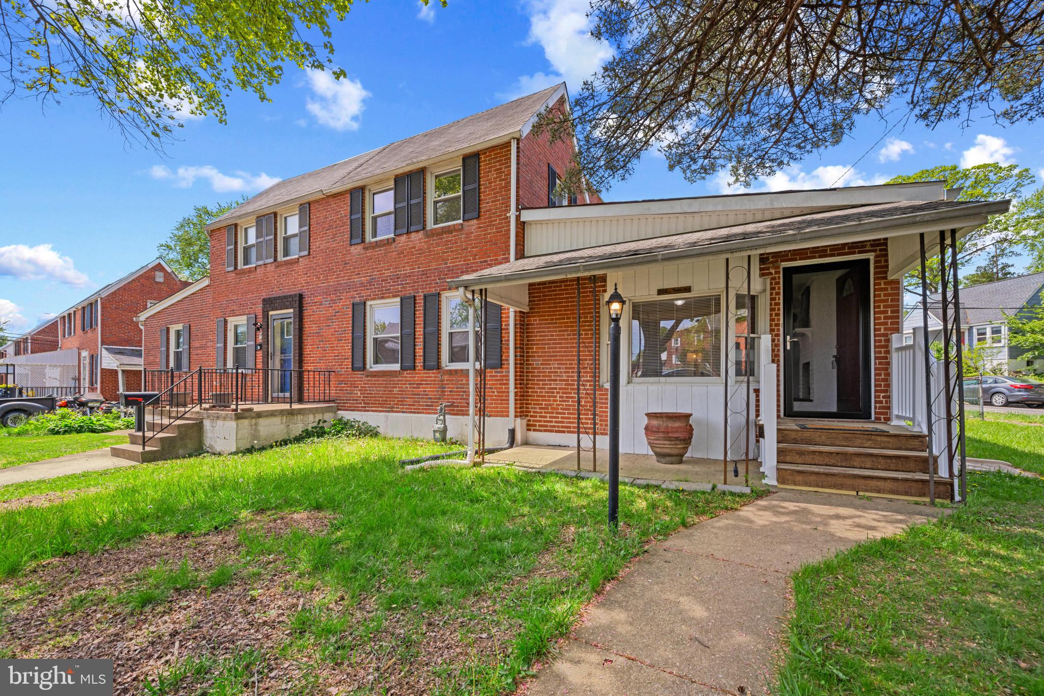 301 3rd Street Baltimore, MD 21206 - Photo 4 of 25 a front view of a house with a yard and porch