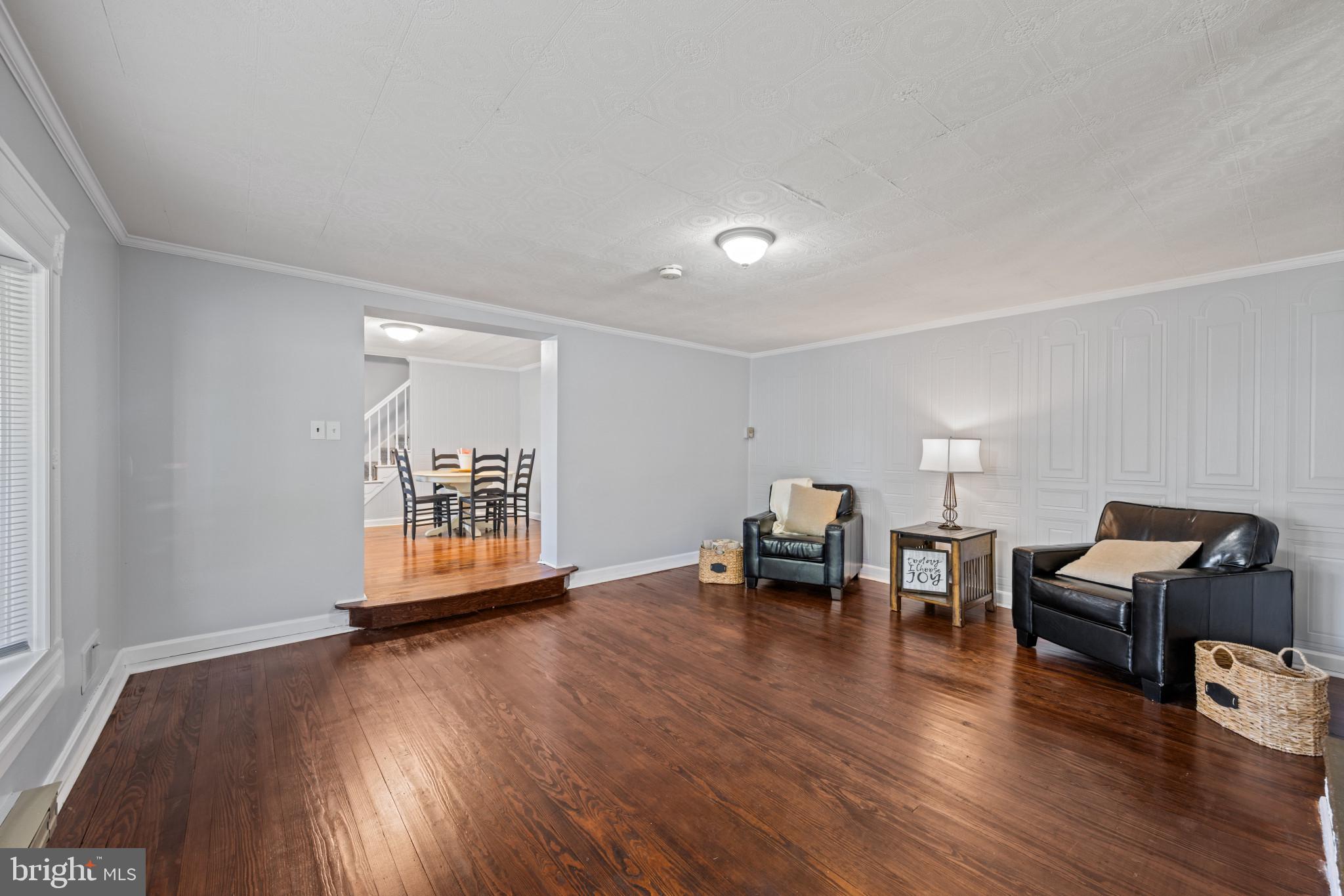301 3rd Street Baltimore, MD 21206 - Photo 5 of 25 a view of a livingroom with furniture and wooden floor