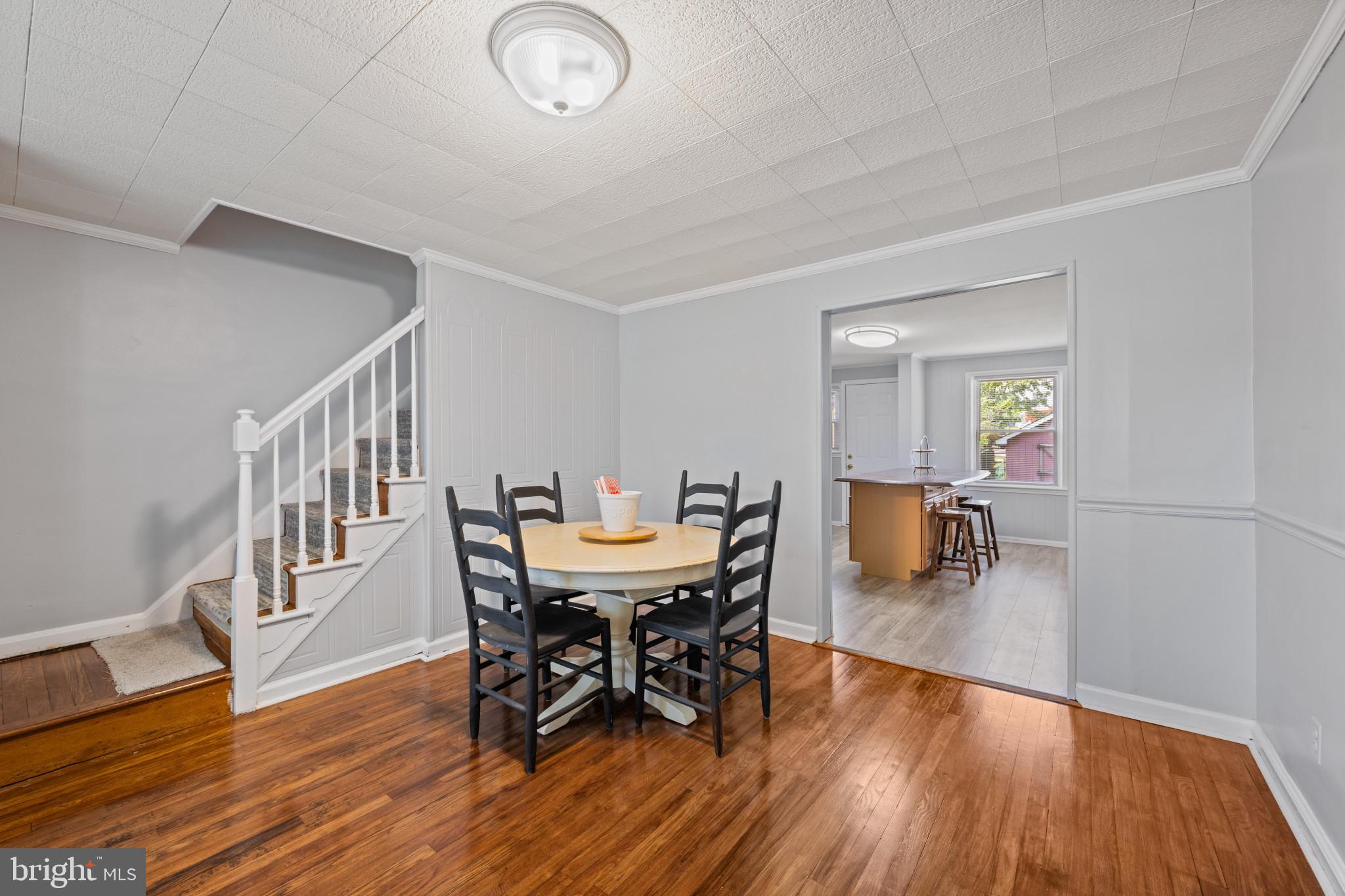301 3rd Street Baltimore, MD 21206 - Photo 8 of 25 a view of a dining room with furniture and wooden floor