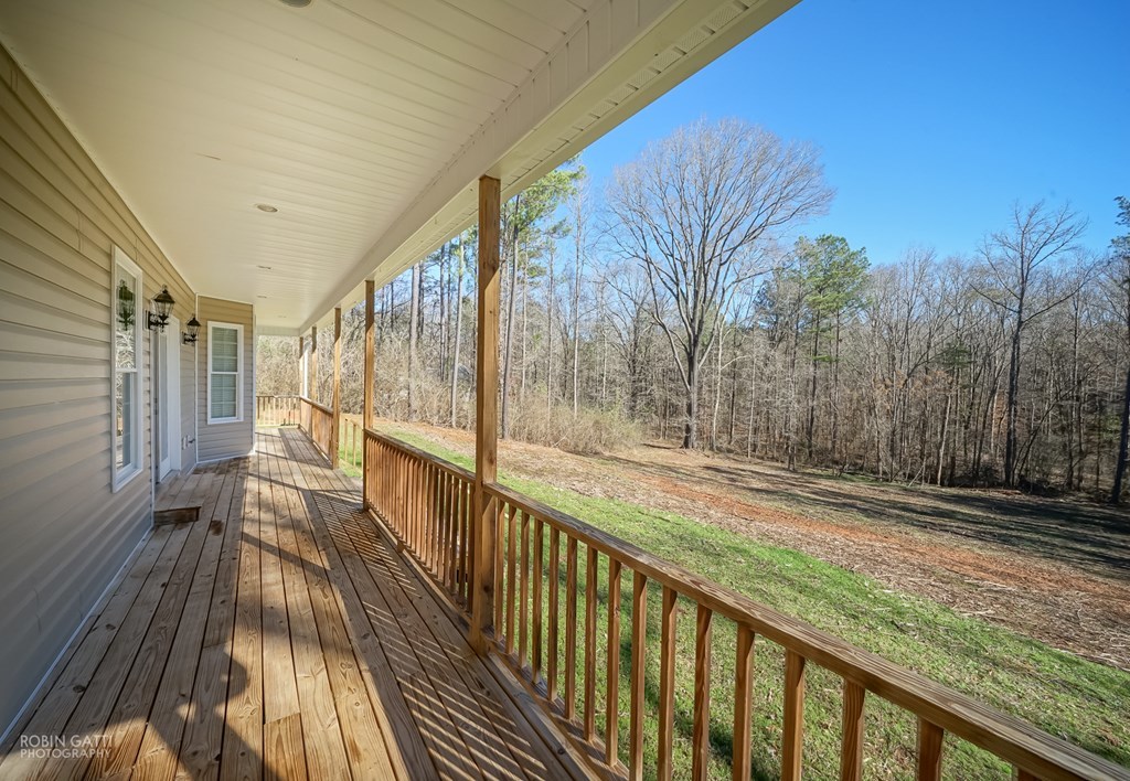 905 Blue Store Road Forsyth, GA 31029 - Photo 22 of 30 a view of balcony with wooden floor