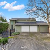 a front view of a house with a garage