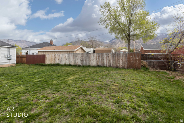 875 Patterson Street Ogden, UT 84403 - Photo 34 of 38 Fenced backyard featuring a mountain view