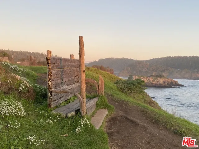 a view of a large body of water with a mountain in the background