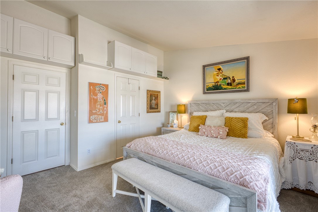 3400 Sunriver Road, Unit D2 Bullhead City, AZ 86429 - Photo 19 of 61 The room features neutral-toned carpeting, white paneled doors, and overhead white cabinetry