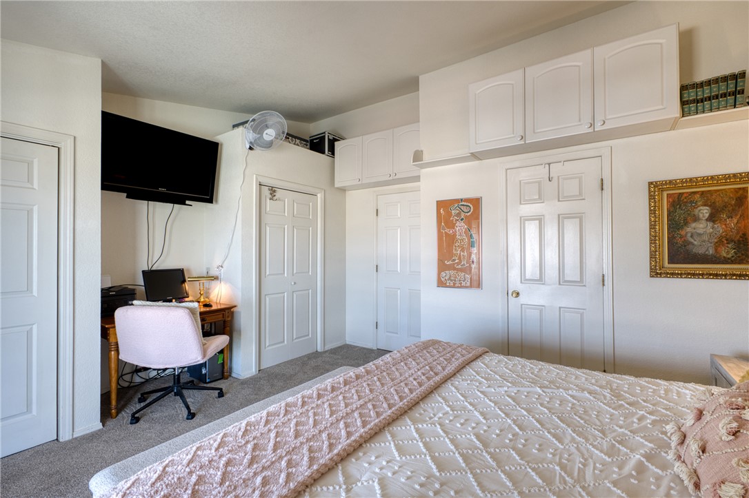 3400 Sunriver Road, Unit D2 Bullhead City, AZ 86429 - Photo 21 of 61 This room features white walls, carpeted flooring, and white paneled doors