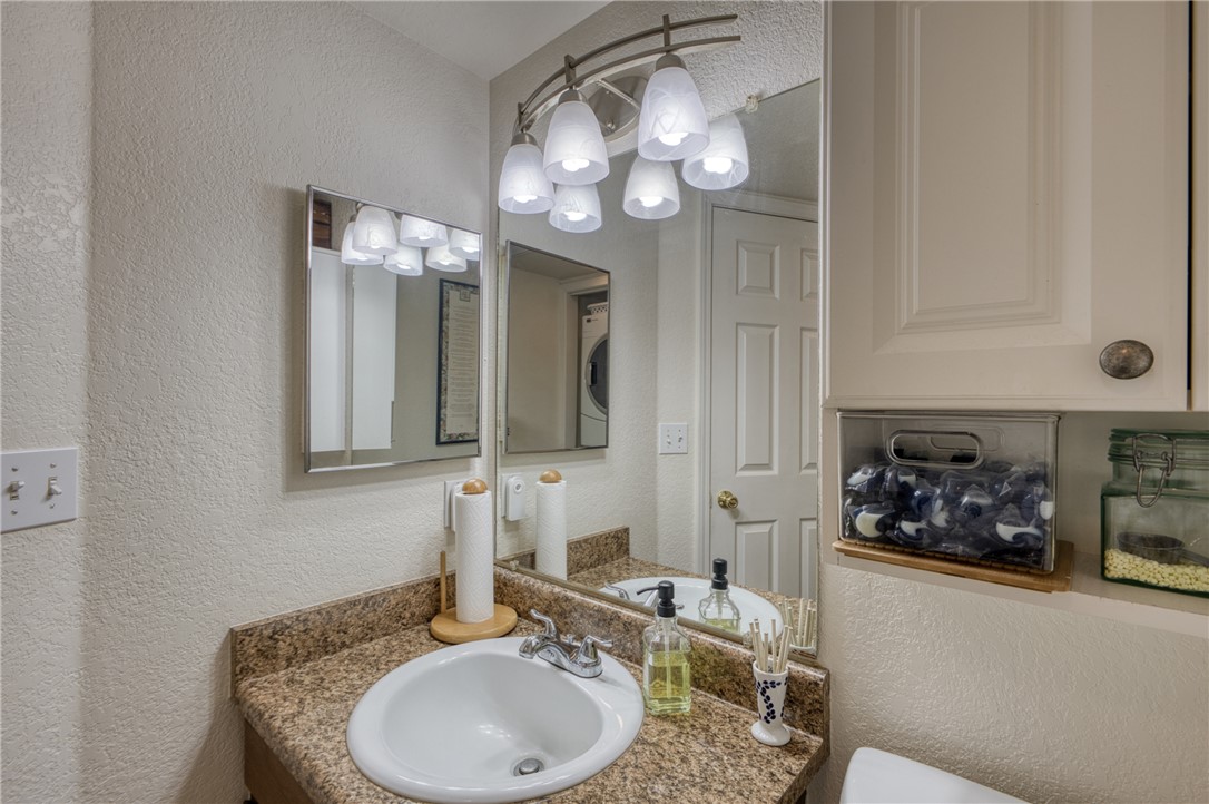 3400 Sunriver Road, Unit D2 Bullhead City, AZ 86429 - Photo 28 of 61 Bathroom vanity with a white basin sink, granite countertop, and a mirrored medicine cabinet