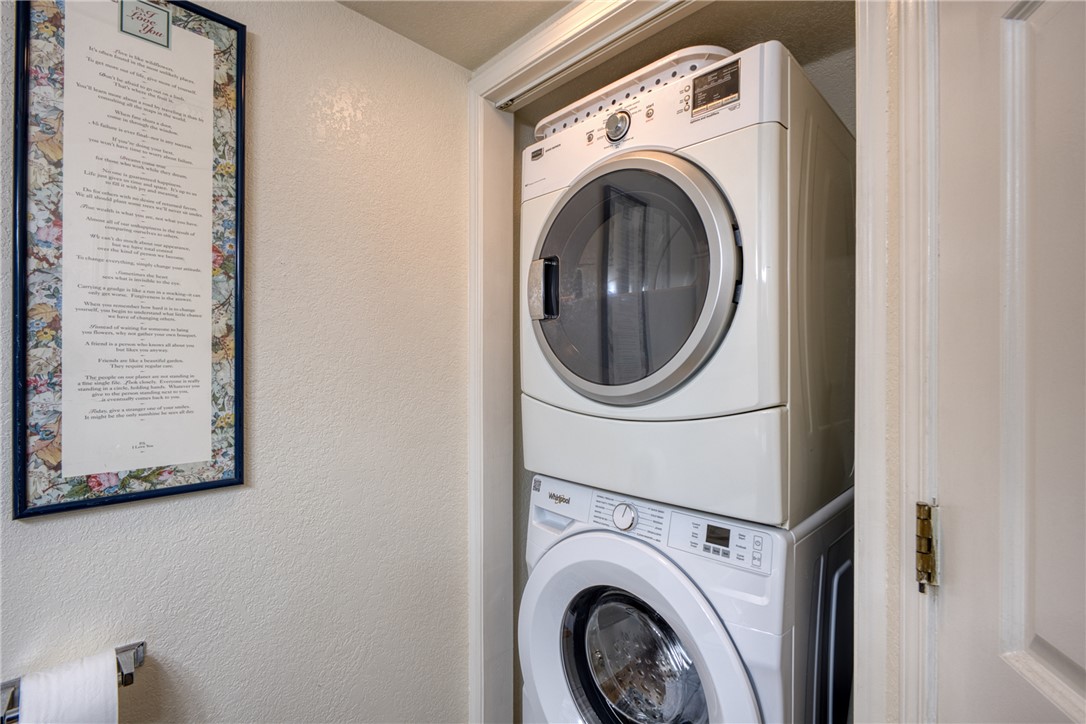 3400 Sunriver Road, Unit D2 Bullhead City, AZ 86429 - Photo 30 of 61 Laundry area featuring a stacked washer and dryer unit