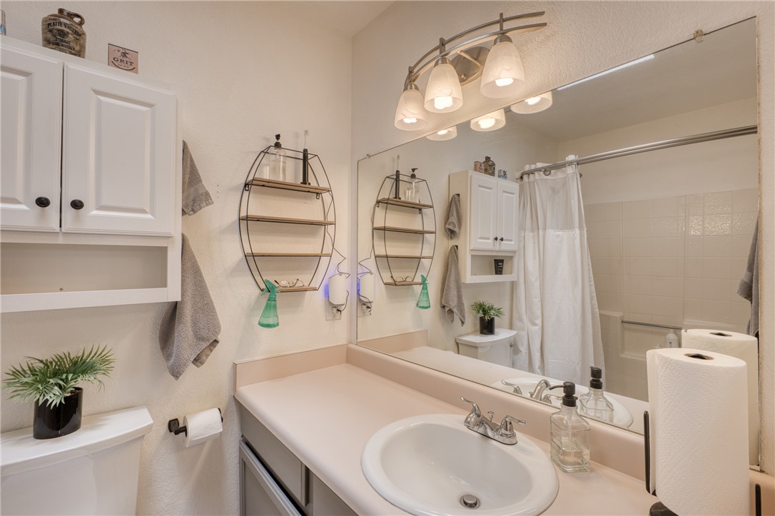 3400 Sunriver Road, Unit D2 Bullhead City, AZ 86429 - Photo 37 of 61 Bathroom featuring a vanity with an integrated sink, a large wall-mounted mirror, and overhead lighting