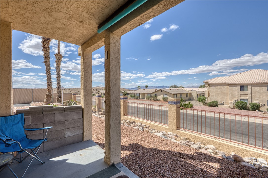 3400 Sunriver Road, Unit D2 Bullhead City, AZ 86429 - Photo 44 of 61 The property features an outdoor patio area with a concrete floor, surrounded by textured walls and pillars