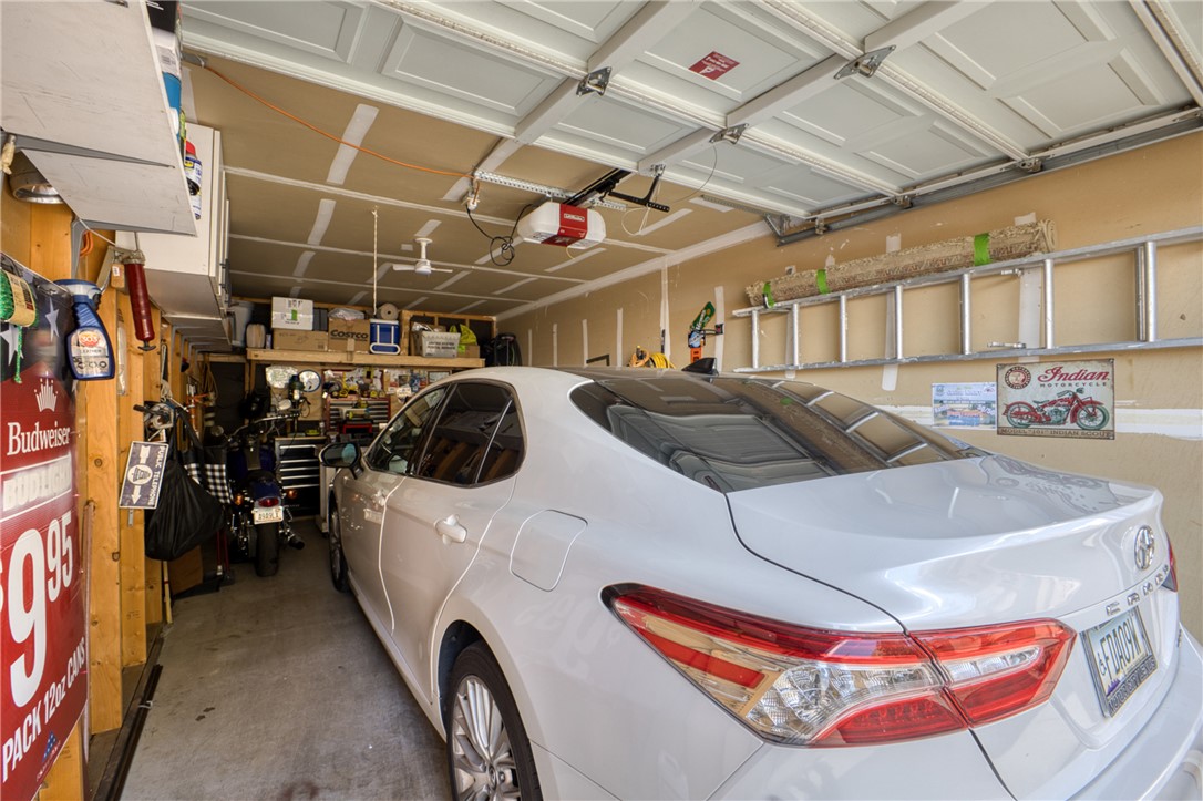 3400 Sunriver Road, Unit D2 Bullhead City, AZ 86429 - Photo 47 of 61 The property includes a garage featuring a ceiling-mounted garage door opener and overhead storage space