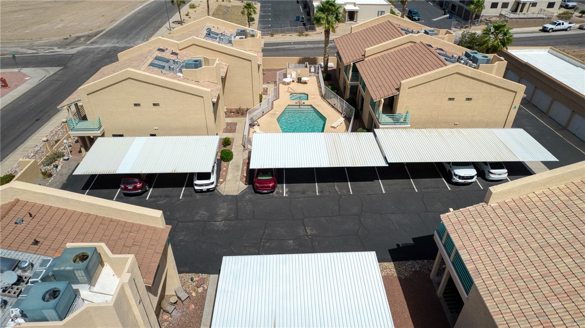 3400 Sunriver Road, Unit D2 Bullhead City, AZ 86429 - Photo 56 of 61 The property features covered parking, a swimming pool, and a hot tub