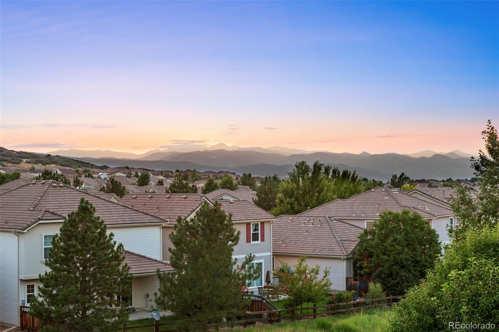 1851 Candleglow Street Castle Rock, CO 80109 - Photo 1 of 1 an aerial view of residential houses with a outdoor space