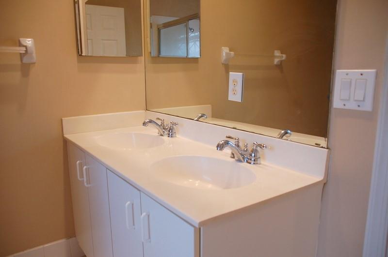 18713 Southwest 26th Street Miramar, FL 33029 - Photo 13 of 32 a bathroom with a sink and a mirror