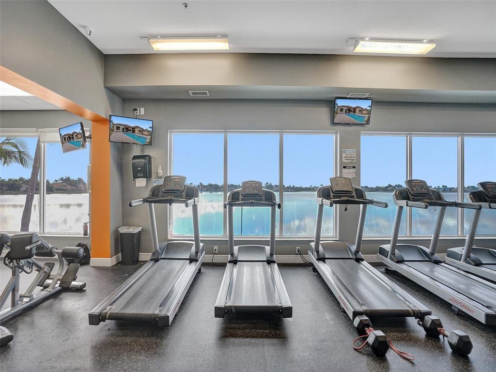 18713 Southwest 26th Street Miramar, FL 33029 - Photo 29 of 32 a room with gym equipment and large mirror