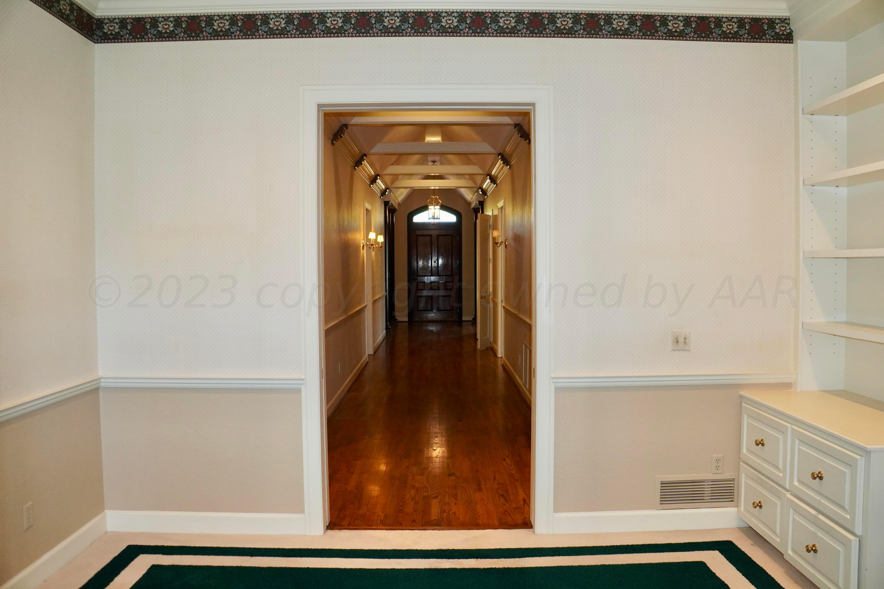 22 Edgewater Drive Amarillo, TX 79106 - Photo 28 of 52 a view of a hallway with wooden floor and staircase