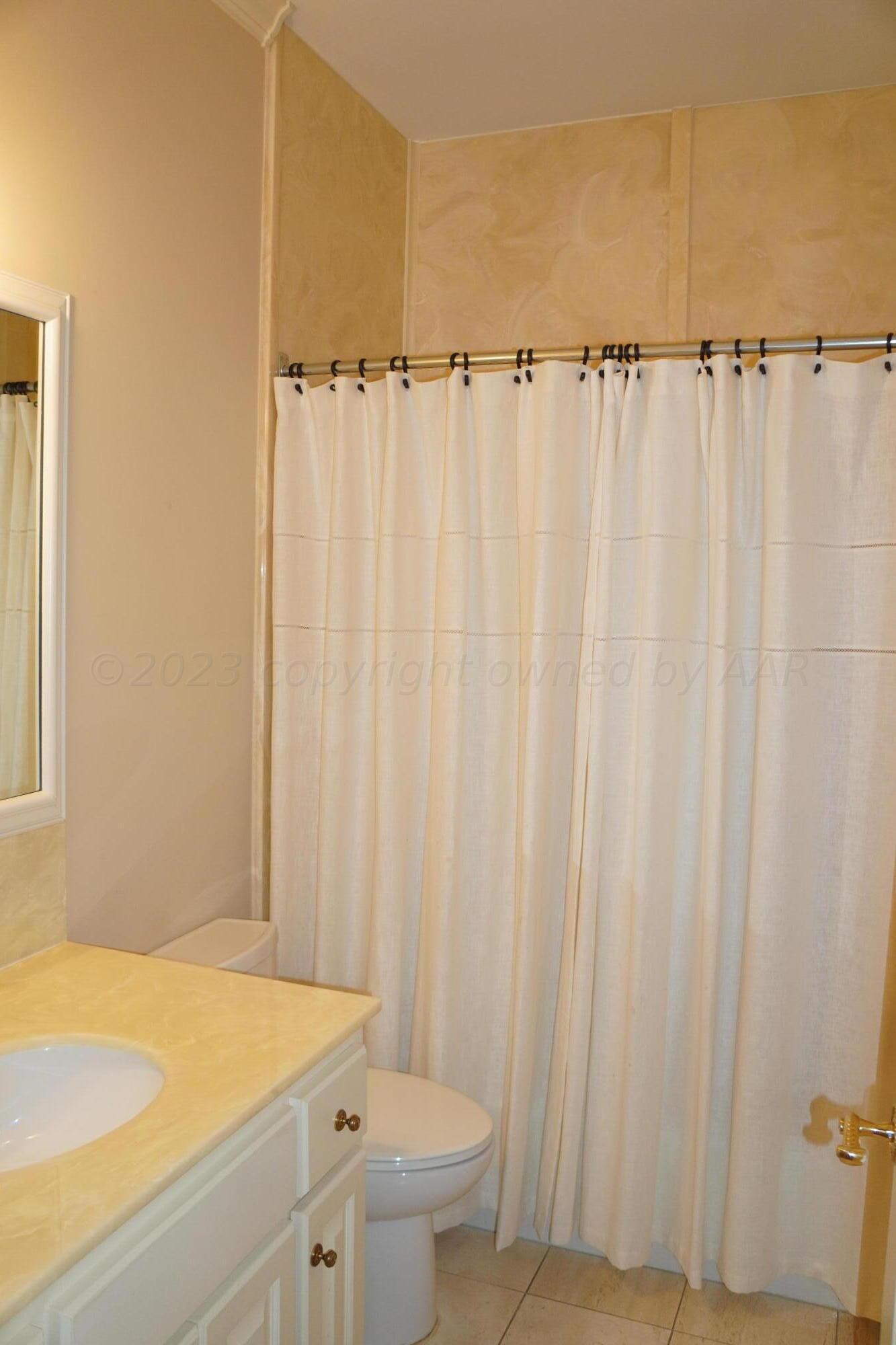22 Edgewater Drive Amarillo, TX 79106 - Photo 42 of 52 a bathroom with a sink and a toilet
