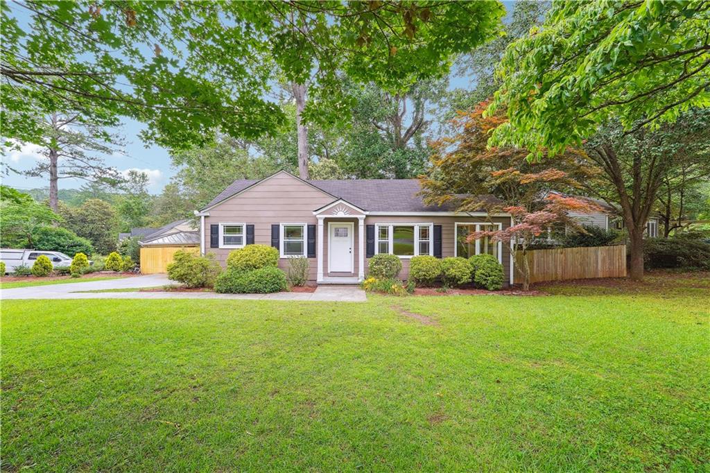2455 Wood Trail Lane Decatur, GA 30033 - Photo 1 of 1 a front view of a house with a garden