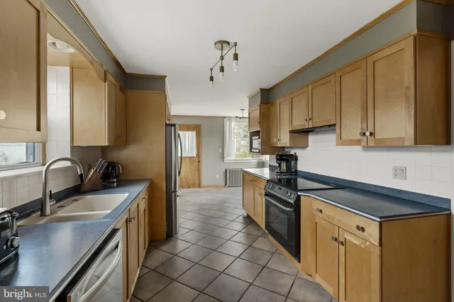 a bathroom with a shower and a sink