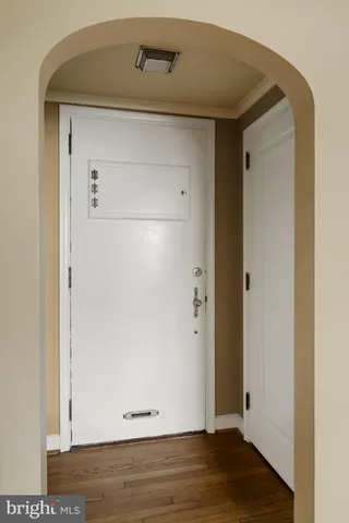 a view of empty room with large windows