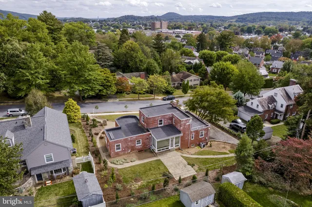 an aerial view of a house with a garden