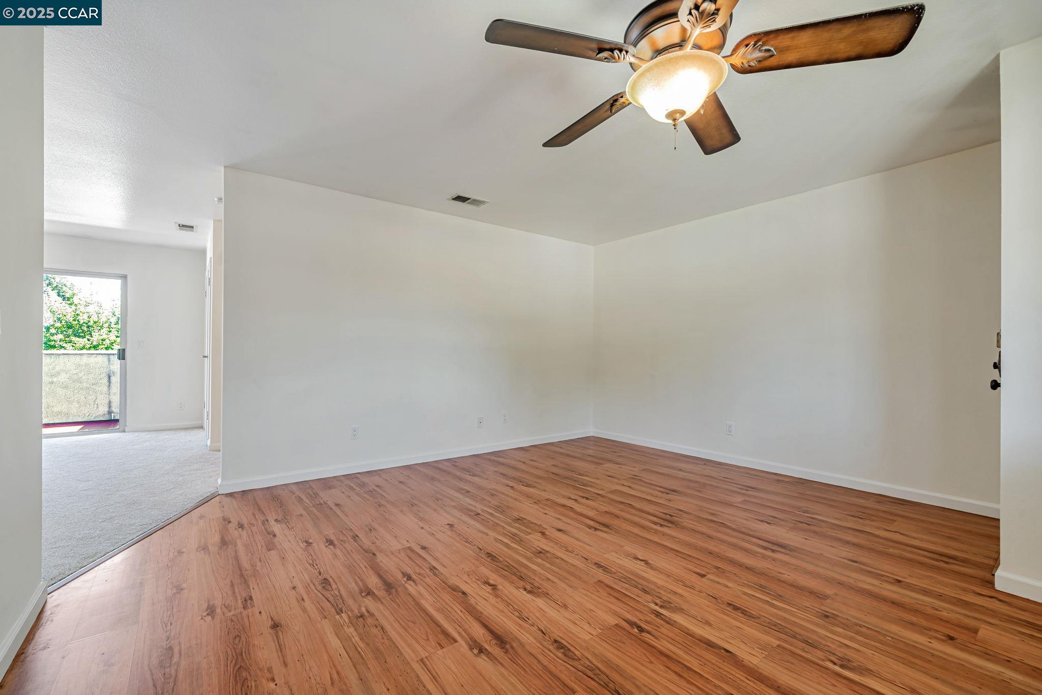 68 Peters Avenue, Unit 6 Pleasanton, CA 94566 - Photo 15 of 40 a view of empty room with wooden floor