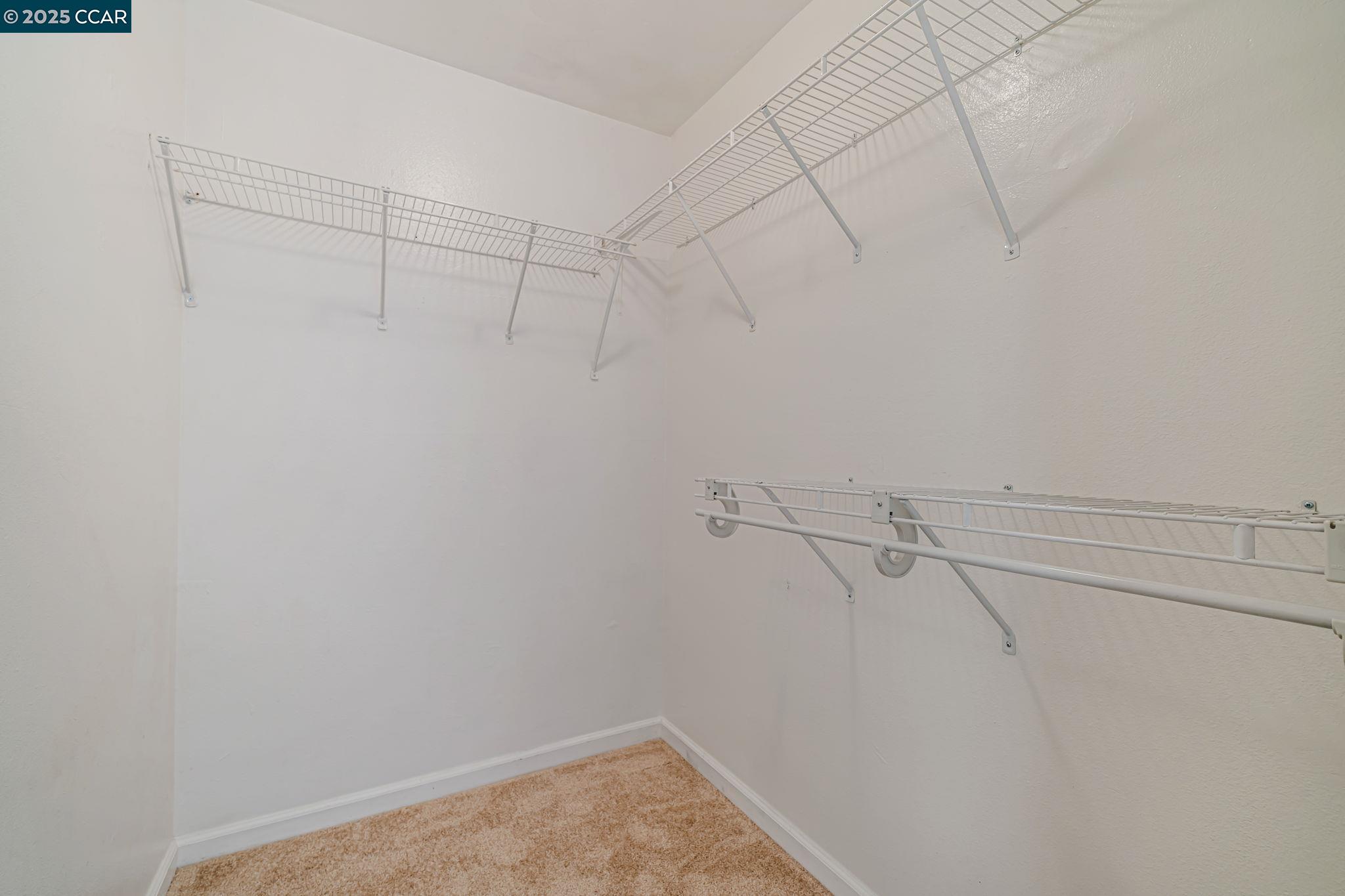 68 Peters Avenue, Unit 6 Pleasanton, CA 94566 - Photo 26 of 40 a view of a room with racks on the wall