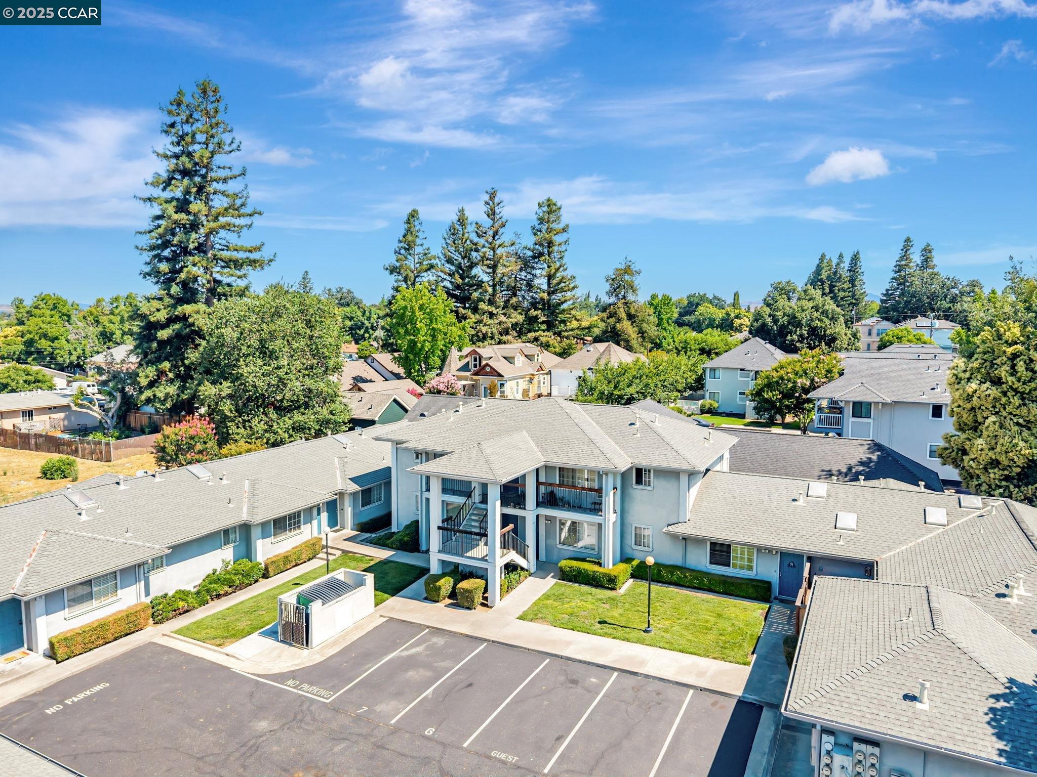 68 Peters Avenue, Unit 6 Pleasanton, CA 94566 - Photo 30 of 40 an aerial view of a house with a swimming pool