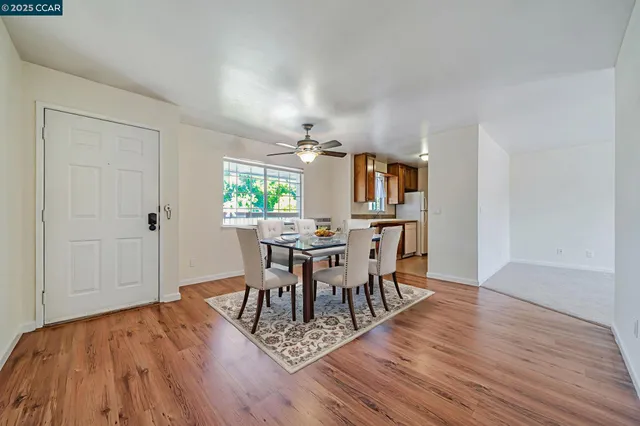 a kitchen with a sink stove top oven and cabinets