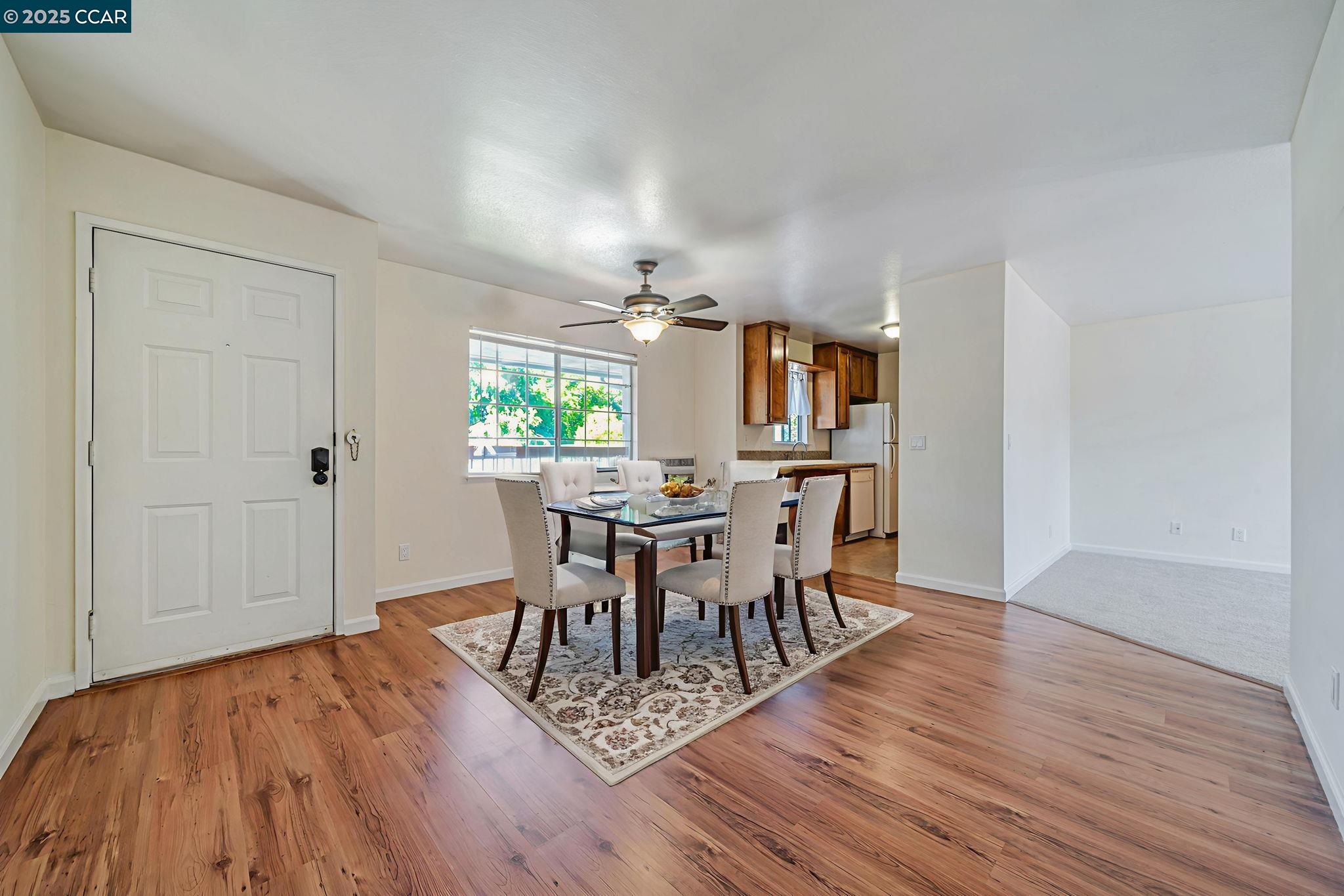 68 Peters Avenue, Unit 6 Pleasanton, CA 94566 - Photo 7 of 40 a view of a dining room with furniture and wooden floor