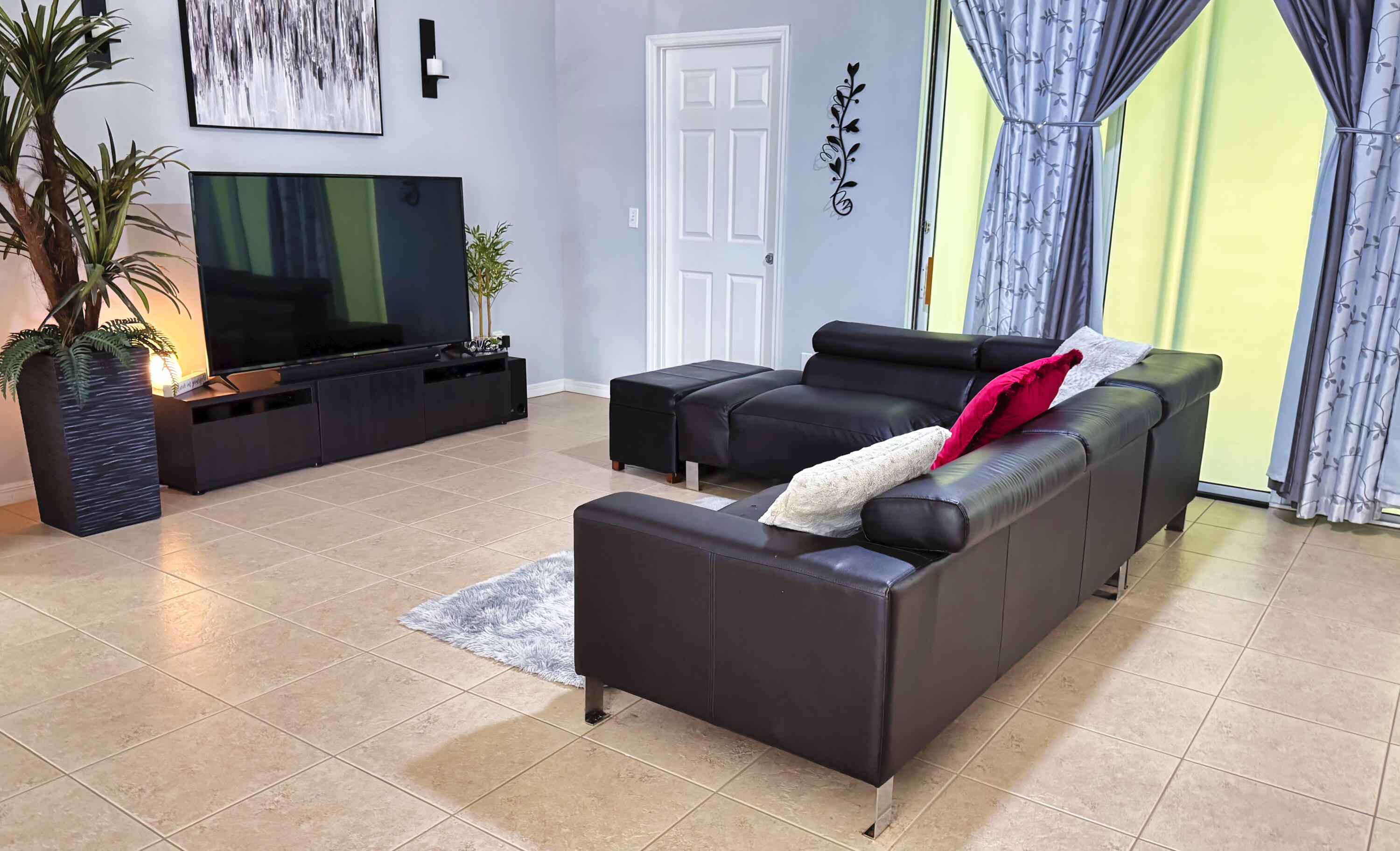 315 Kaye Street Fort Pierce, FL 34947 - Photo 19 of 66 a living room with furniture and a flat screen tv