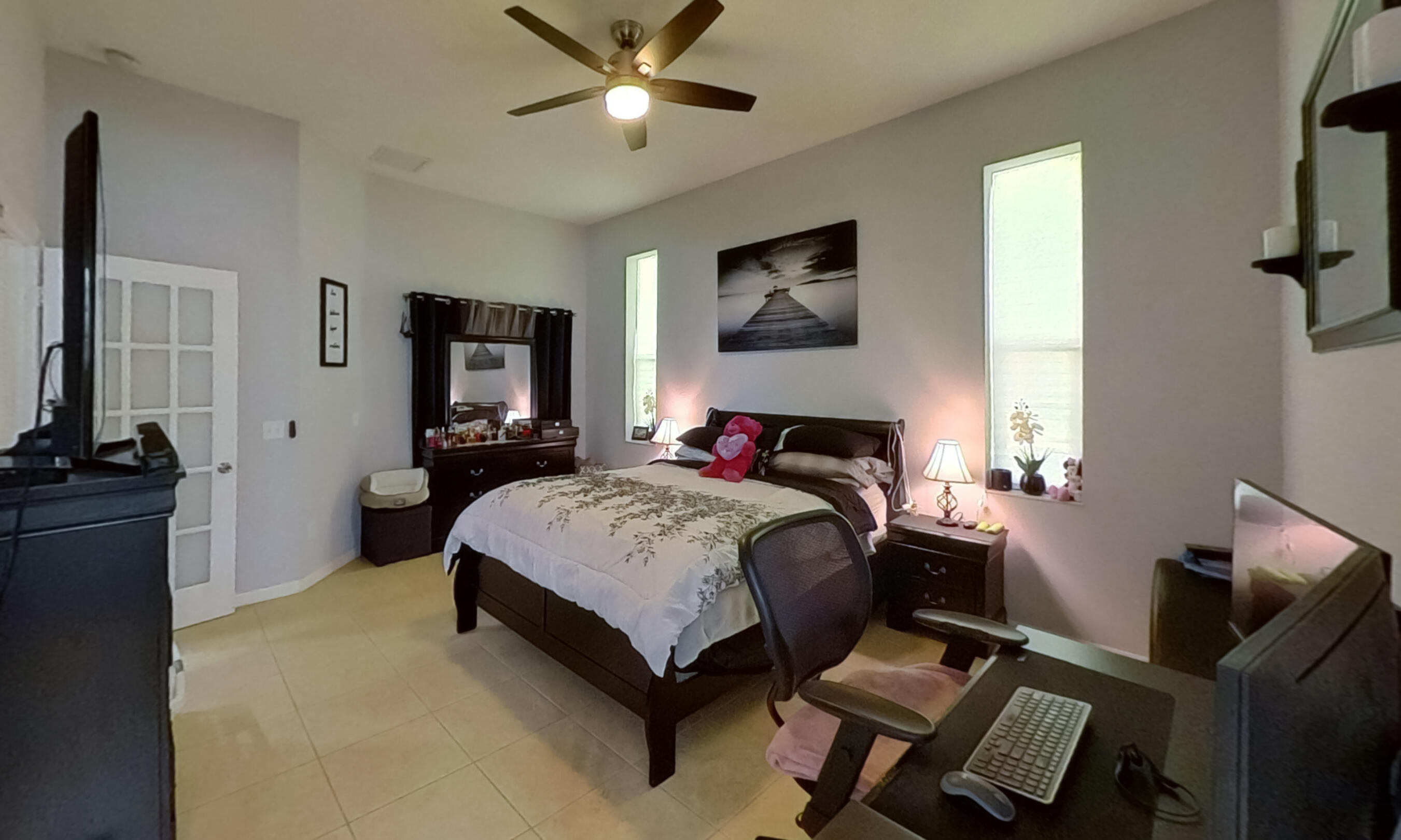 315 Kaye Street Fort Pierce, FL 34947 - Photo 31 of 66 a bedroom with a bed and wooden floor