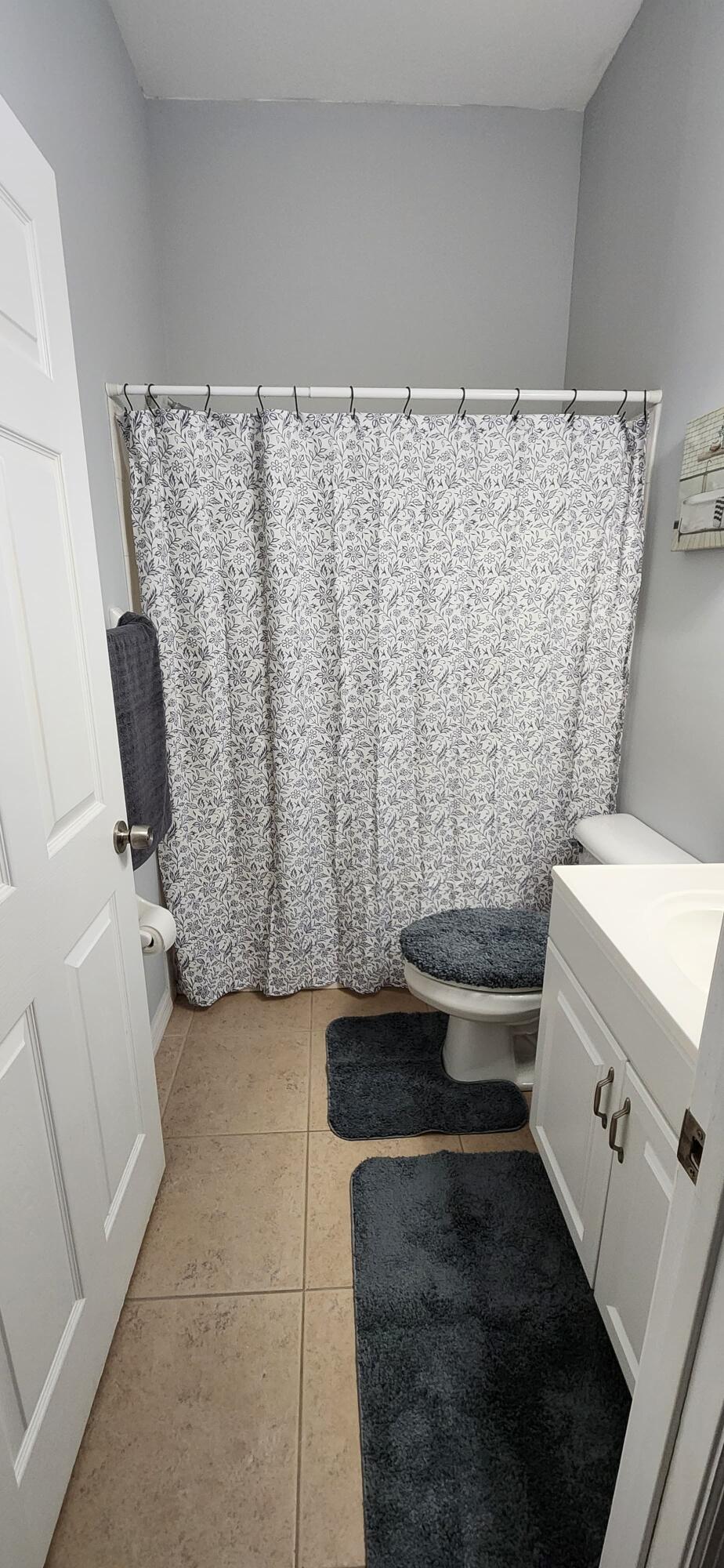 315 Kaye Street Fort Pierce, FL 34947 - Photo 60 of 66 a bathroom with a granite countertop sink and a mirror