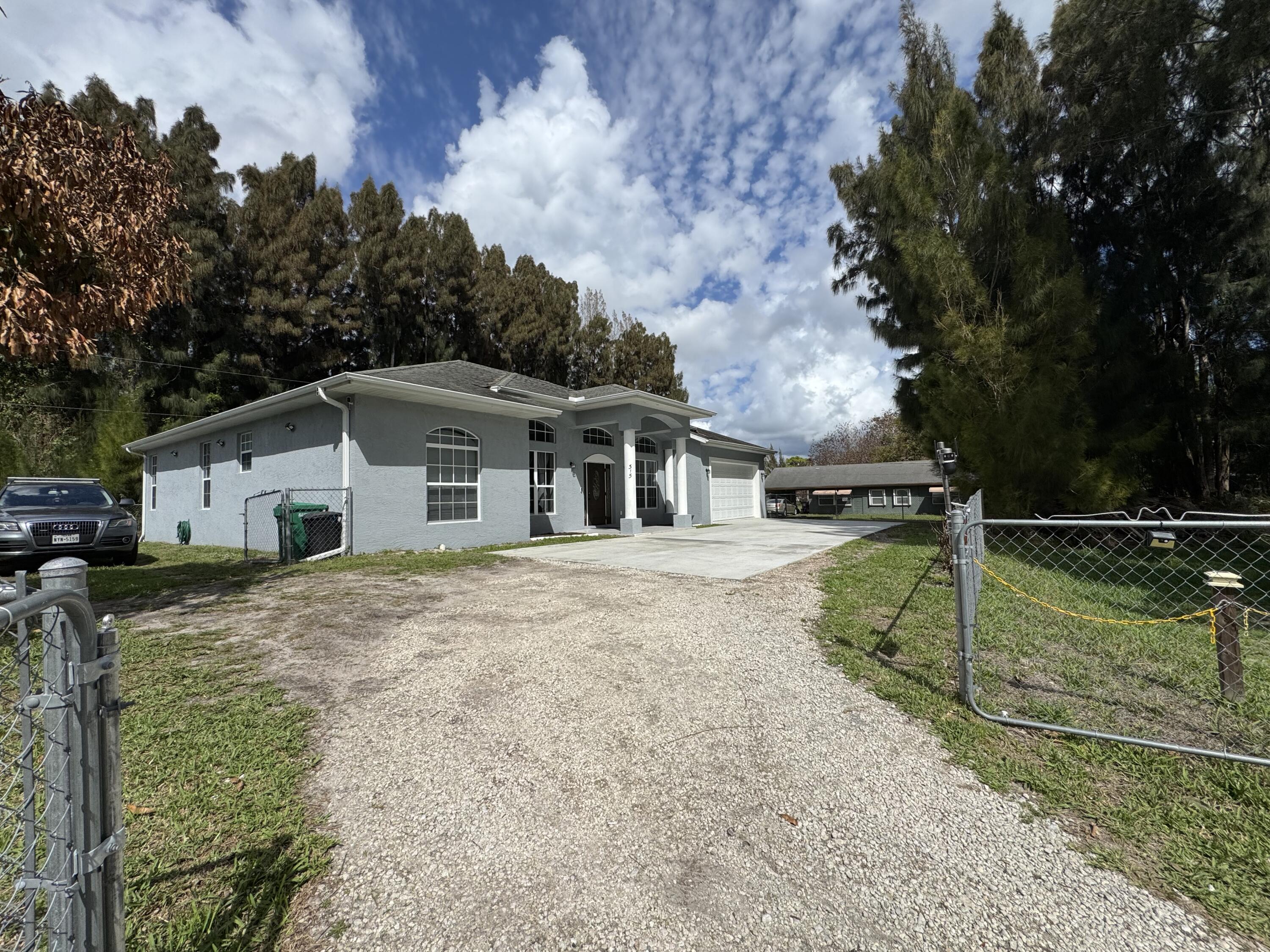 315 Kaye Street Fort Pierce, FL 34947 - Photo 6 of 66 a view of a house with a backyard