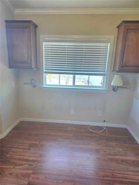 14280 Northeast 124th Avenue, Unit 242 Okeechobee, FL 34974 - Photo 12 of 19 a view of a room with wooden floor and a window