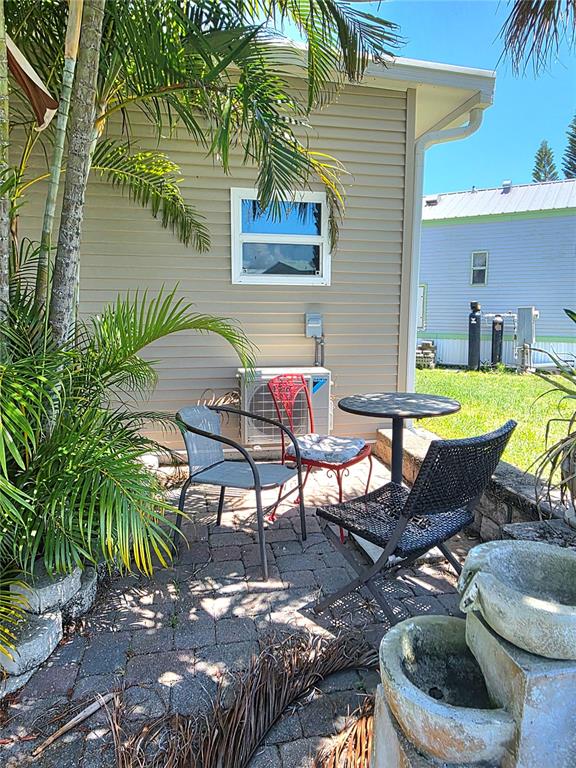 14280 Northeast 124th Avenue, Unit 242 Okeechobee, FL 34974 - Photo 18 of 19 a backyard of a house with outdoor seating