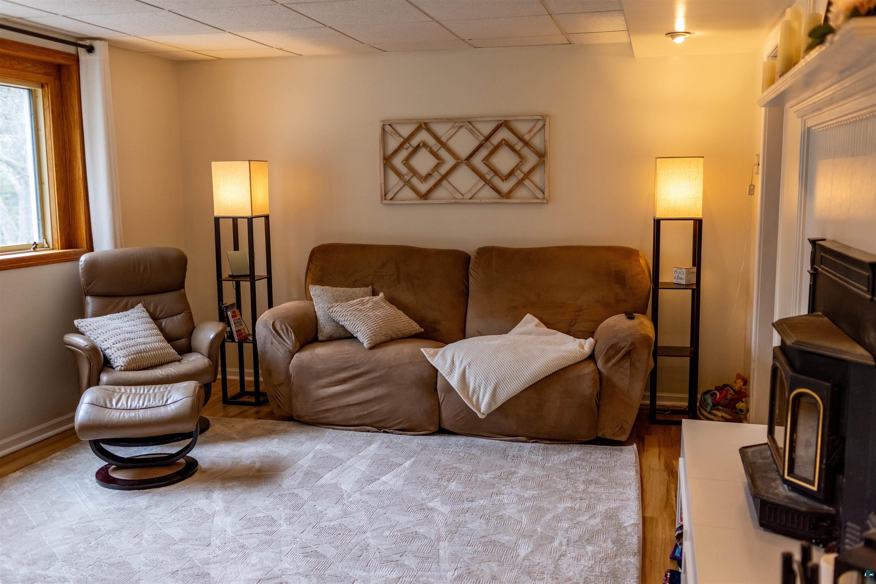 3704 Greysolon Road Duluth, MN 55804 - Photo 26 of 51 Carpeted living space with a drop ceiling