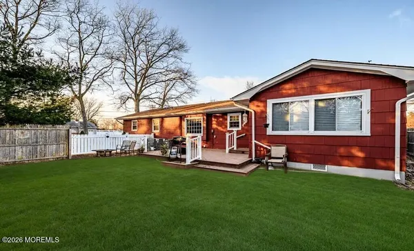 a view of a house with a yard porch and sitting area