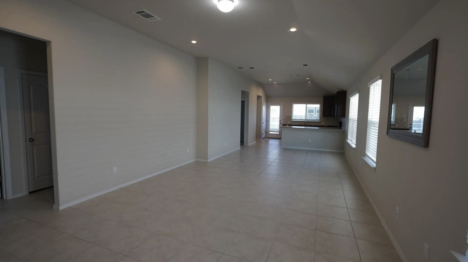 251 Tempest Trail Maxwell, TX 78656 - Photo 14 of 15 Hallway with recessed lighting, light tile patterned flooring, and lofted ceiling
