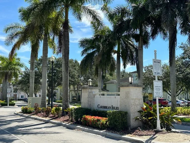 a view of front door and potted plants