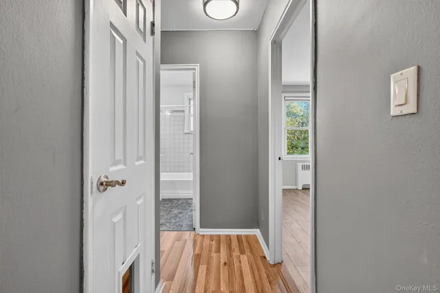 a bathroom with a sink and glass door