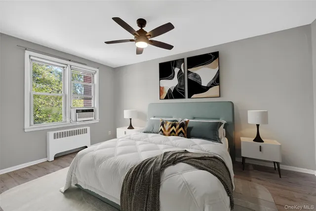 a bedroom with a large bed and a window