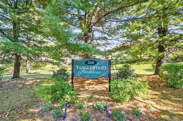 a sign that is on a brick wall